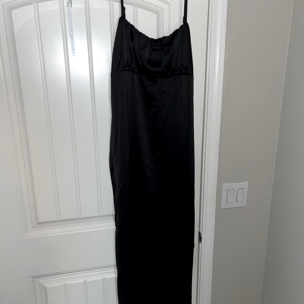 Long black silky dress with leg slits on sides. Never worn.
